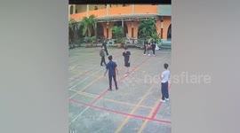 Teacher whacked on the head by wayward football shot in school yard