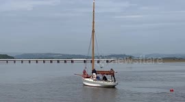 Classic wooden, gaff rigged boat, on the Kent Estuary, off Arnside, Morecambe Bay