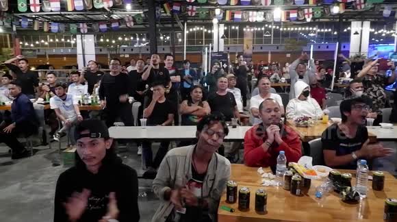 Indonesian soccer fans watch Messi's Argentina beat France in World Cup final