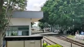 Dosey pedestrian almost hit after ambling in front of oncoming train