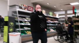 Last minute Christmas Eve shoppers strip the shelves of Waitrose