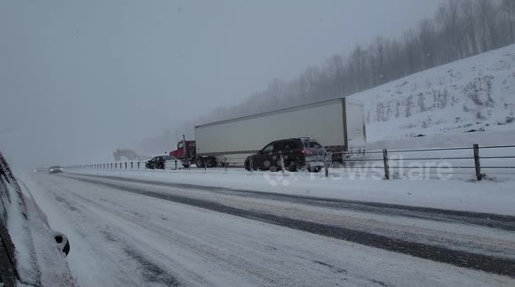 Snowstorm blasting Canadian road leaves semi-truck totally stuck