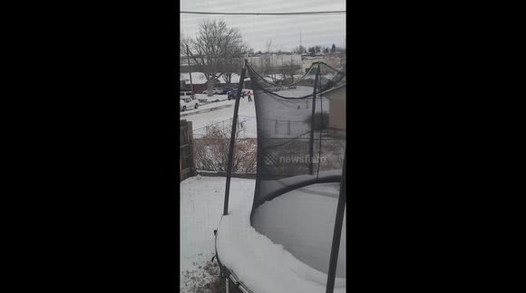 This guy is showing his Christmas spirit in a snowy road, just don't get run over buddy