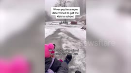 Mum and kids forced to SLEDGE to school after icy conditions made using the car impossible