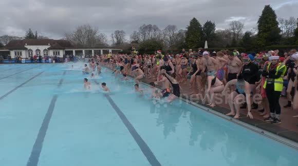 UK swimmers brave cold waters in Christmas Day plunge in Gloucestershire