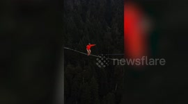 Stunning footage shows daredevil highliner walking along line just one inch thick whilst 100 METRES IN THE AIR
