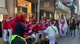 Manhattan Samba Group perform in Christmas costumes in Fifth Avenue, New York
