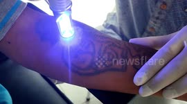 Indonesian prisoners remove her tattoo to make amends and distance themselves from their past