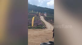 Go-kart racers have epic crash on dusty downhill track in Thailand