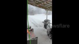 Machine removes snow from streets of Watertown, NY, USA