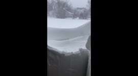 Snow wall outside front door in New York as winter storm hits US