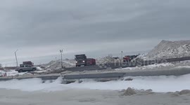 Dump trucks transporting snow after winter storm in Buffalo, NY, USA