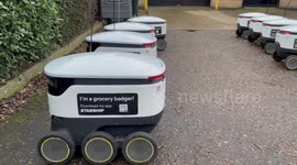 Starship robots waiting ideally outside closed store waiting to make food and package deliveries