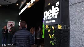 Green and yellow flowers seen outside Pele Soccer Store in New York