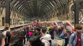 Extreme weather leads to flooded conditions and travel chaos at London's King Cross Station
