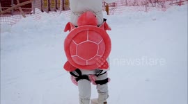 Tourists Wear Little Turtles Ski Protection at A Ski Resort in Yichang, China