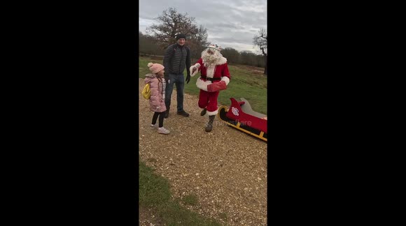'Santa Cruise' hands out presents to kids in London while riding an electric sleigh