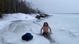 Canadian dad rings in New Year with an arctic plunge into a frozen lake