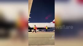 Airport staff stage lightsaber duel for delayed passengers in San Jose, California