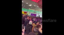 Members of the Kurdish community carrying coffins during funeral in Villiers-le-Bel, France