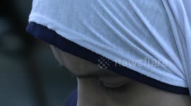 Palestinian blind studens write on Braille machine on the World Braille Day at a school