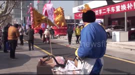 Street vendor dressed in traditional costume to promote his bread