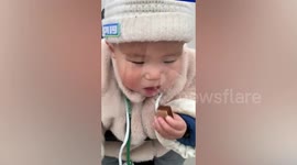 Chinese toddler distraught after realising he can't eat while wearing face shield