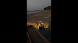 Pair of lions steal drinks table from tourists watching from car just feet away