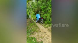 Health workers trek through countryside to conduct contact tracing in Philippine province