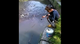 Fisherman falls into water after section of riverbank collapses