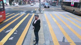 Pedestrians Zebra Crossing in Hong Kong, China