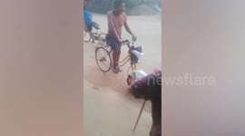 Cambodian cyclist shows off bizarre modified bike with motorcycle wheel attached to the front