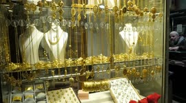 Palestinians buy gold from shops in the gold market, in Gaza city