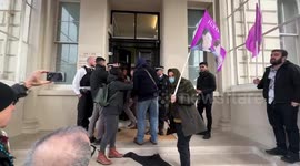 Police stop protesters from attaching a black cloth to their door