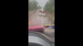 Two cows fight on a highway in Vietnam, making many vehicles unable to move