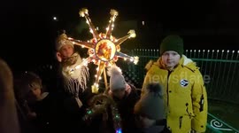 Ukrainian children in decorated costumes sing Christmas carols