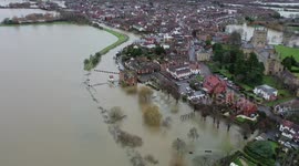 Tewkesbury Abbey turned into an island as flood water streams off the Malverns