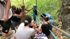 German tourist, 19, rescued after falling down steep cliff steps leading to cave in Thailand