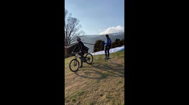 Creative, adrenaline junkie hooks his cycle to dad's paraglider for a CRAZY stunt