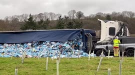 Scary scene as both drivers alive after large truck topples on top of Land Rover