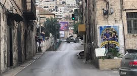 Palestinian demonstrators clash with Israeli forces, during a military raid