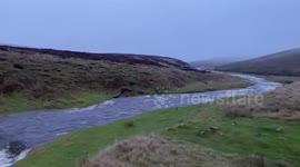 Stunning footage shows a 60ft deep waterfall completed filled-in following heavy flooding