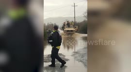 US emergency services navigate their way through California's flooded streets
