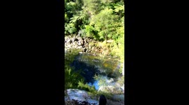 Man jumps into waterfall to complete daring 100-foot leap