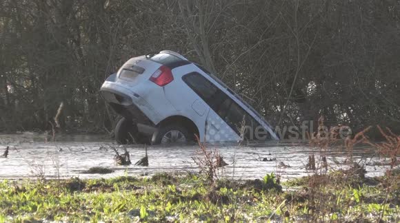 Car submerged and caravan park flooded as River Severn bursts banks in Worcestershire