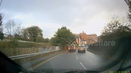 An idiot driver overtakes in a built up area, then drives into the police tape as road closed.(Re-Edit)
