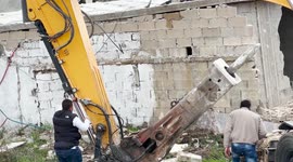 Palestinian Harbi Rajabi from Beit Hanina neighborhood demolish his own home after Israeli municipality forced him, under the pretext it was built without a permit, in Jerusalem