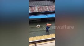 Plant pot floats away during storm in southern Thailand