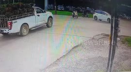 Motorcycle rider survives crash by landing on car roof