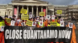 'Close Guantánamo': Activists dress in orange prisoner uniforms in London after anniversary of its opening
